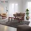 A living room scene with a sofa, armchair, coffee table, rug, and a plant in a pot. Náhled obrázku produktu