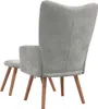 A grey velvet armchair and footstool are shown from the back. Náhľad obrázku produktu