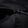 A close-up shot of a black jacket's zipper. Produktbild-Vorschau