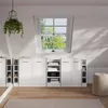 A white high-gloss storage cabinet set is displayed in a room with a sloped ceiling and a window. Voir les images du produit