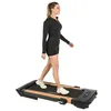A woman is walking on a treadmill against a white background. Produktbild-Vorschau