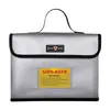 A silver fireproof LIPO-SAFE bag with a warning label and a small logo. Produktbild-Vorschau