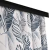 A close-up view of a curtain with a leaf pattern. Produktbild-Vorschau