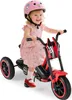 A young child is riding a red electric tricycle. Náhled obrázku produktu