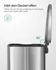 Close-up of a stainless steel trash can lid held open at a 90-degree angle, with instructional text and icons. Produktbild-Vorschau