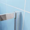 Close-up of a shower enclosure corner with blue tiled background. Produktbild-Vorschau