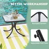 A small square glass-topped table with a black metal base is shown next to a swimming pool, with a yellow and white striped rug underneath. The image also includes close-up shots highlighting rounded corners and adjustable foot pads. Podgląd zdjęcia produktu