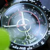 A close-up of a Timex watch face with compass markings and a green leaf in the foreground. Podgląd zdjęcia produktu