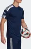 A man wearing a navy Adidas t-shirt and shorts, holding a soccer ball. Voir les images du produit