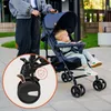 A person pushing a stroller with a baby in it. Náhled obrázku produktu