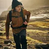 A man hiking in a rocky, mountainous terrain. Náhled obrázku produktu