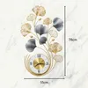 A decorative wall clock with a floral design, shown against a marble-like background. Produktbild-Vorschau