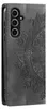 A close-up, side view of a grey smartphone case with a mandala design embossed on it. Produktbild-Vorschau
