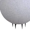 A close-up view of the bottom part of a spherical outdoor lamp with a textured gray surface and black spike-like legs. Produktbild-Vorschau