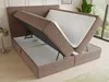 A brown boxspring bed with its storage compartments open, revealing the mattress and storage space. Produktbild-Vorschau
