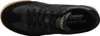A top-down view of a black sneaker with a brown sole. Produktbild-Vorschau