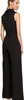 A woman wearing a black jumpsuit, shown from the back. Podgląd zdjęcia produktu