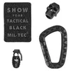 A collection of tactical accessories including a patch, a skull charm, a carabiner, and a grenade-shaped keychain. Podgląd zdjęcia produktu