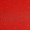 A close-up view of a red fabric surface with water droplets. Produktbild-Vorschau