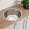 A stainless steel sink with chopsticks and a glass inside, set into a wooden countertop. Náhled obrázku produktu
