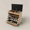 A wooden shoe cabinet with a black upholstered seat on top, open lid revealing storage, and multiple shelves displaying shoes. Náhľad obrázku produktu