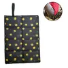 A folded outdoor seat cushion with a lemon pattern. Produktbild-Vorschau