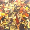 A close-up view of a mixture of dried fruits, seeds, and vegetables, likely bird food. Náhled obrázku produktu