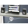 A laptop, two speakers, and a white power strip are arranged on a desk. Produktbild-Vorschau
