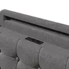 A close-up view of a gray upholstered headboard with integrated USB and Type-C charging ports. Podgląd zdjęcia produktu