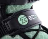 A close-up view of a black strap with a green logo and text on a green mesh fabric. Podgląd zdjęcia produktu