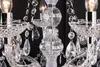 A close-up view of a crystal chandelier with multiple arms and hanging crystals. Náhled obrázku produktu