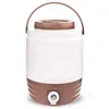 A white and brown beverage dispenser with a handle and a tap. Produktbild-Vorschau