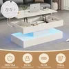 A white coffee table with storage and LED lights, shown with its top lifted to reveal storage compartments. Produktbild-Vorschau