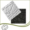 Two 3D wall panels, one white and one black, are shown diagonally on a white background. A green wavy border frames the image, with a recycling symbol at the bottom left. Podgląd zdjęcia produktu