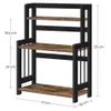 A three-tiered shelf unit with a vintage brown wood finish and black metal frame, shown with dimensions indicated. Produktbild-Vorschau