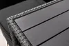 Close-up of a grey rattan garden bench with a wooden tabletop. Produktbild-Vorschau
