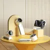 A collection of portable fans and a smartphone displayed on a yellow table. Náhľad obrázku produktu