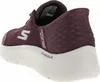 A close-up side view of a burgundy Skechers slip-in sneaker with a white sole. Anteprima dell’immagine prodotto