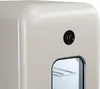 A close-up of a small, beige mini-fridge with a digital temperature display. Produktbild-Vorschau