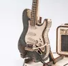 A close-up of a wooden model electric guitar and amplifier on a white background. Voir les images du produit