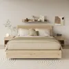 A bedroom scene with a bed, nightstands, and decor. Podgląd zdjęcia produktu