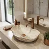 A bathroom vanity with a sink and faucet. Anteprima dell’immagine prodotto