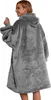A woman is shown from behind wearing a large, gray hooded blanket. Náhľad obrázku produktu