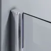 A close-up view of a shower screen corner, showing the chrome frame and glass. Podgląd zdjęcia produktu