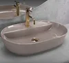 A modern bathroom sink with a gold faucet. Náhled obrázku produktu