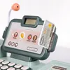 A close-up of a toy cash register with a credit card inserted. Produktbild-Vorschau