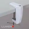 A white clamp attached to the edge of a light gray desk. Produktbild-Vorschau