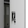 A close-up view of a gray metal cabinet with a black lock and key. Voir les images du produit