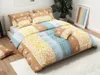 A neatly made bed with colorful bedding and pillows. Náhľad obrázku produktu