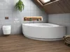 A modern bathroom with a corner bathtub, toilet, and wooden floor. Produktbild-Vorschau